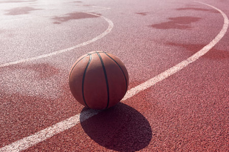 Basketball ball on the urban court background.の写真素材