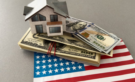 Dollar banknotes and USA national flag. paper house
