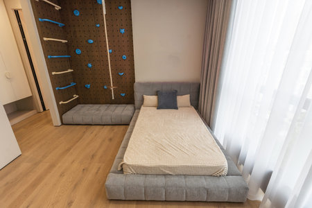 Interior of a cozy and bright bedroom with beautiful decorationの写真素材