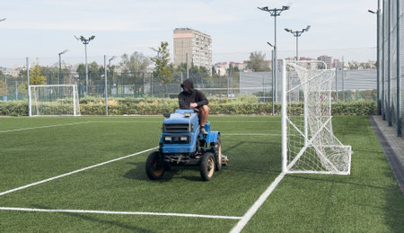 soccer field and worker in fieldの写真素材