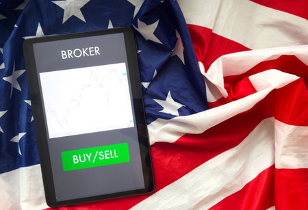 Stock market on digital tablet screen. Modern business lifestyle. Boosting of the stock market. Digital tablet showing charts and diagramの写真素材