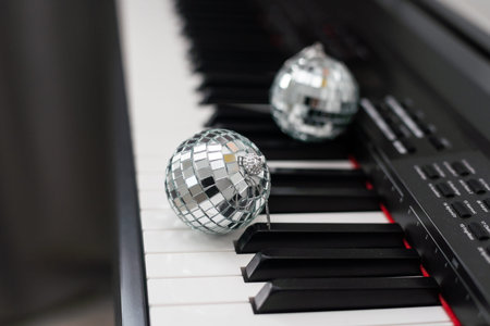 Piano keyboard with Christmas decoration, closeup.
