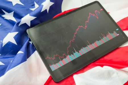 Investors analyze the data stock market index via smartphone screen to trade the stock chart for...