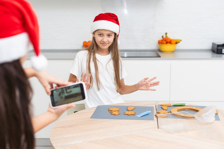 kids baking christmas cookies before the celebration of Christmas. Familyの写真素材