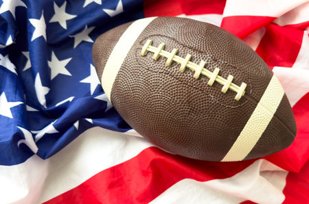 Football ball against national flag of USAの写真素材