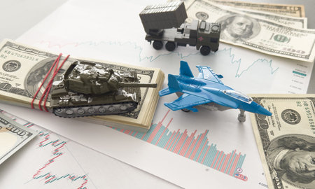 Military toy airplane jet aircraft fighter, economic graphs and moneyの写真素材