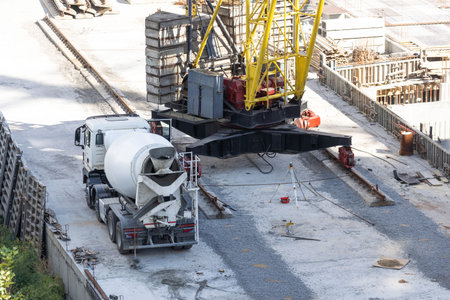 Construction worker Concrete pouring during commercial concreting floors of building in construction...