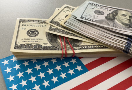 One hundred dollars banknotes on flag background