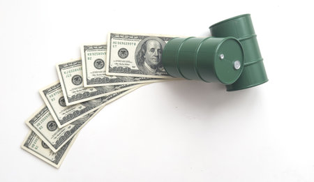 barrel of oil on money background Dollar bills chart earnings import products. idea: the oil business, buying selling, trading, stock exchangeの写真素材