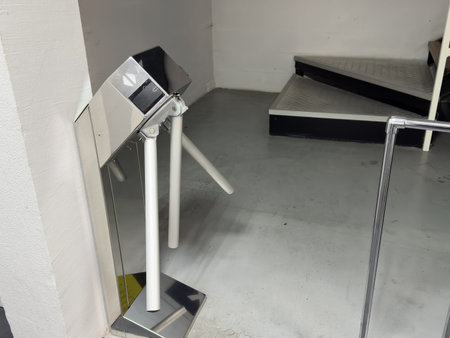 Entrance with turntables. A checkpoint with a turnstile. Turnstile with card reader. Electronic...