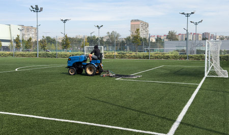 soccer field and worker in field