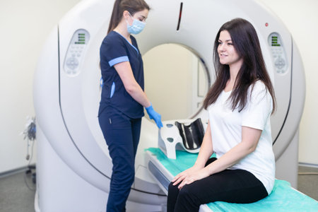Doctor doing computed tomography for female patient stock photo. Medicine diagnostic concept