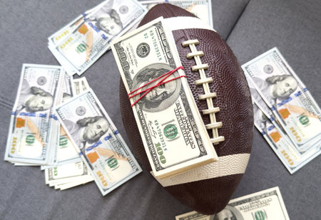 American football or rugby. dollars. Concept sport and money.の写真素材