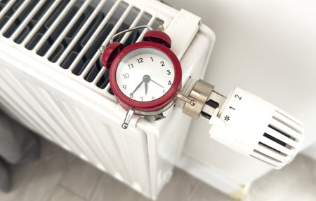 House heating inclusion concept. Battery clock to heat the roomの写真素材