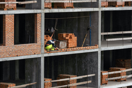 Construction of apartment buildings, dense urban development. The process of construction of residential buildings.の写真素材