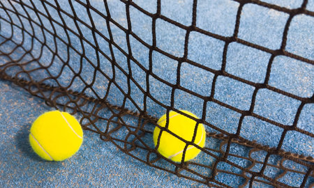 Paddle tennis ball on the court for background.