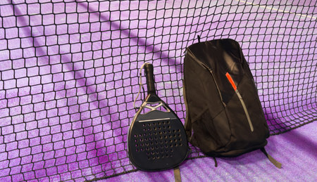 bag with tennis padel racket and ball on grassy field at tennis court, copy space. Unaltered, sport, competition, green, nature and summer concept.の写真素材