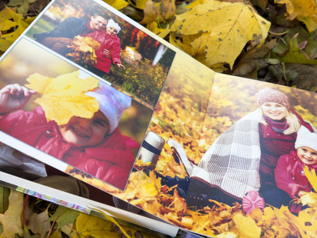 Photobook on the leaves background, closeup of photobook, family photo albumの写真素材