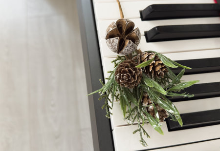 Piano keyboard with Christmas decoration, closeupの写真素材