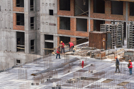 Construction workers working on Construction machine. Aerial platform for workers who work at height...