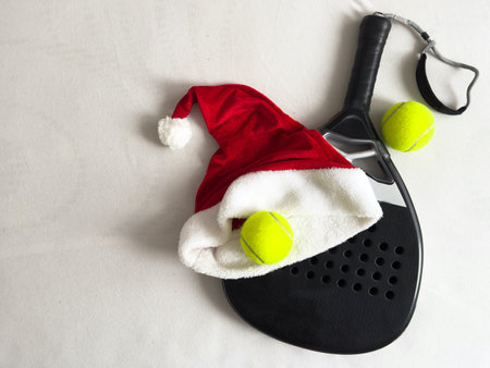 Christmas Open Padel Tournament. Poster for social networks for New Years games. Padel tennis racket on tournament. paddle racket on courtの写真素材