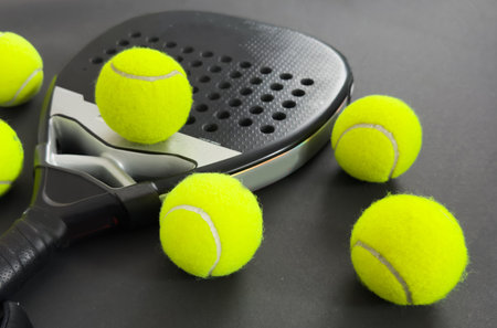 Padel tennis racket sport court and balls. Download a high quality photo with paddle for the design of a sports app or soical media advertisementの写真素材