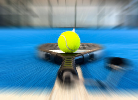 Padel tennis racket. Background with copy space. Sport court and balls.の写真素材