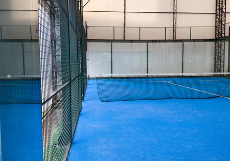 blue paddle tennis court net close upの写真素材