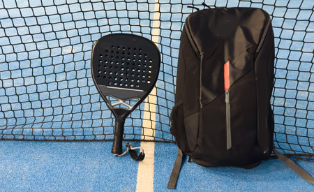 bag with tennis padel racket and ball on court, copy space. Unaltered, sport, competition, green, nature and summer concept.の写真素材