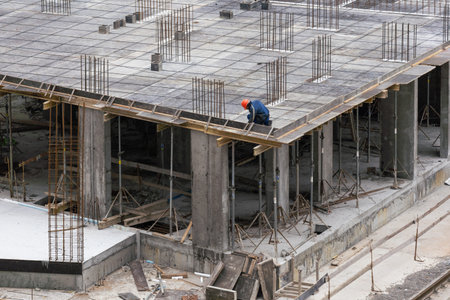 Construction workers working on Construction machine. Aerial platform for workers who work at height...