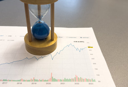 hourglass with forex trading bars on background. Studio shot.の写真素材