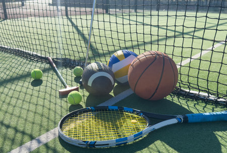 Different sport equipment on green grass, flat lay. Space for textの写真素材