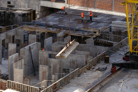 Concrete drainage pipes at the construction site. Laying of underground storm sewer pipes. Installation of water main, sanitary sewer. Installation of concrete sewer wells in the groundの写真素材