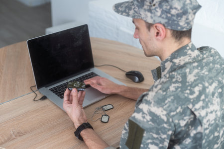 military man holding a model tankの写真素材
