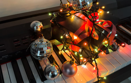 Piano keyboard with Christmas decoration, closeupの写真素材