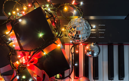 Piano keyboard with Christmas decoration, closeupの写真素材