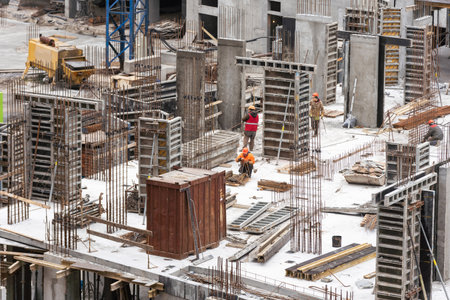 Construction workers working on Construction machine. Aerial platform for workers who work at height on buildings.の写真素材