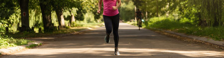 Pretty sporty woman jogging at park
