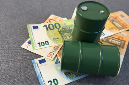 oil barrel with money, euro banknotes closeupの写真素材