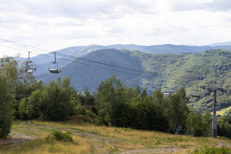 Mountain lift on sky background. Empty space for text