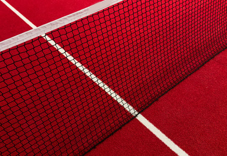 View of the net and the centre line of a red paddle tennis court. Racket sportsの写真素材