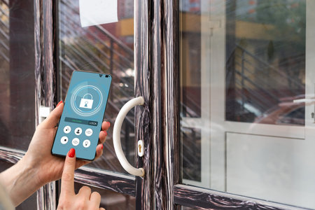 Cropped image of female entering secret key code for getting access and passing building using...