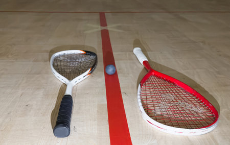 Empty squash court and rackets on the wooden floor.の写真素材