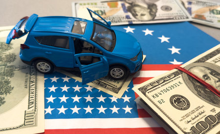 Car on the dollar money and usa flag, finance purchase sale insurance conceptの写真素材