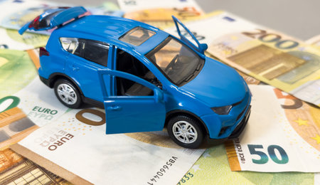 Car and money. Concept for buying, renting, insurance, fuel, service and repair costs