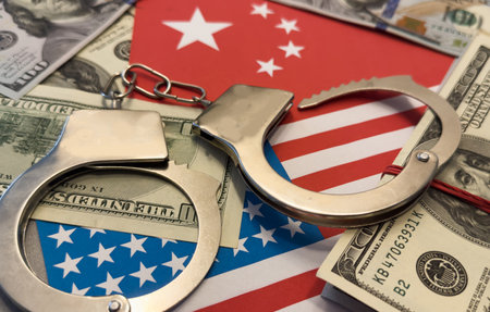 United States of America flag with handcuffs and a bundle of dollars. Currency corruption in the country. Financial crimesの写真素材