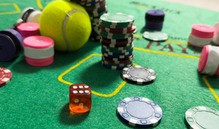 Poker chips and tennis ball