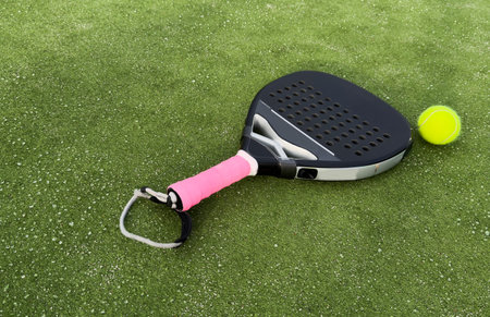 Padel tennis racket sport court and balls. Download a high quality photo with paddle for the design...