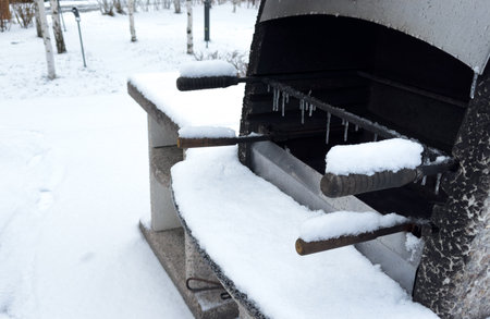 Grill and counter table tops in a snowy backyard.の写真素材