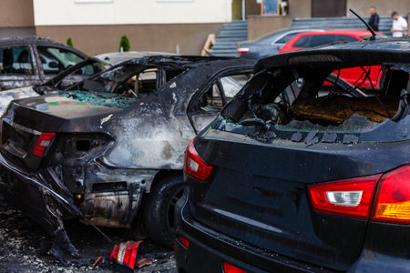 A cropped front view of a burned and abandoned rusty carsの写真素材